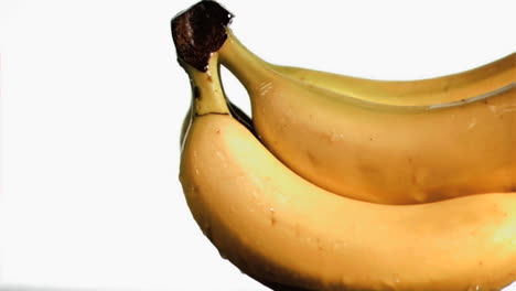 delightful bananas in super slow motion receiving water