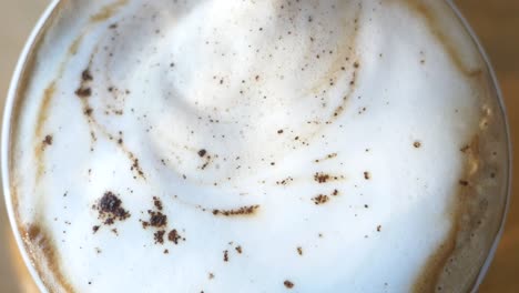 closeup of a cappuccino with a stirring spoon