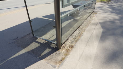 bus stop in city with weathered asphalt base underneath, motion view