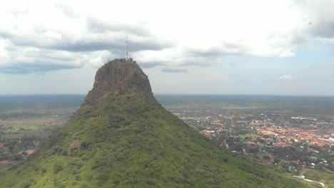 aerial orbit around a large rock in a ugandan township