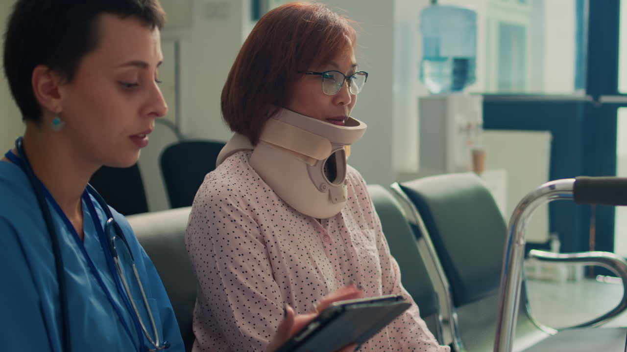 Nurse consulting with patient in waiting room