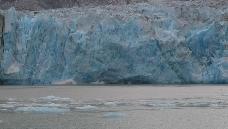 Slow-motion-calving-of-the-melting-Sawyer-glacier-in-Tracy-Arm,-Alaska-4K