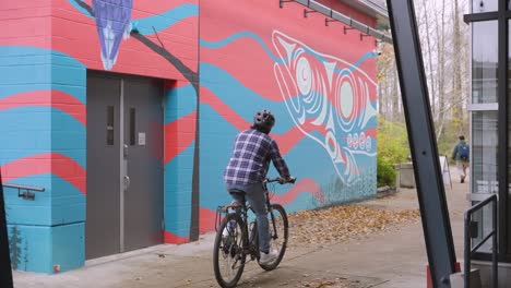 A man cycling around Port of Coquitlam.
