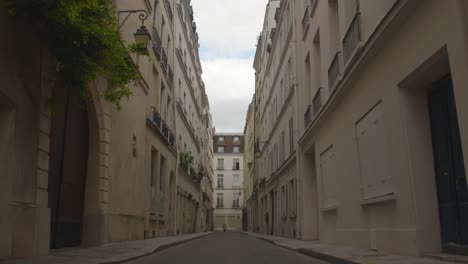 closed apartment buildings on the narrow street in ile-saint-louis, 4th arrondissement of paris in france