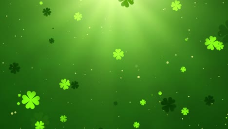 glowing green clovers floating in sunlit background with falling particles for st. patrick’s day - loopable animation of shamrocks rotating in a vibrant green backdrop