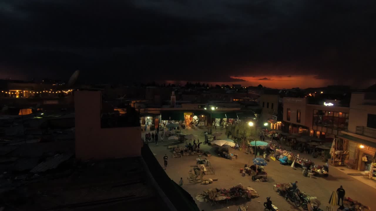 Stormy night with lightnings in Marrakesh. Evening with a strong orange sunset and storm.
