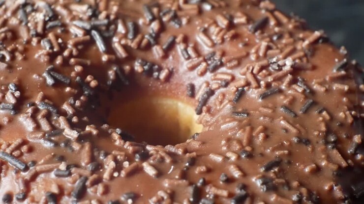 Delicious chocolate glaze donut homemade tasty sprinkles toppings sweet food close-up
