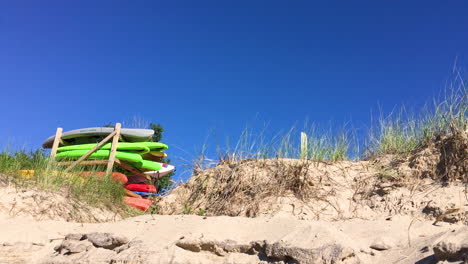 kayaks on rack at the beach