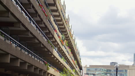 flower boxes outside residential apartments in the barbican centre in city of london uk