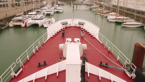 view from the bow of a ship in a marina