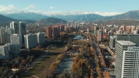 araucano park surrounded by modern building structures in las condes, santiago, chile