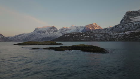 rugged beauty of snowy arctic mountains, oystercatchers in flight