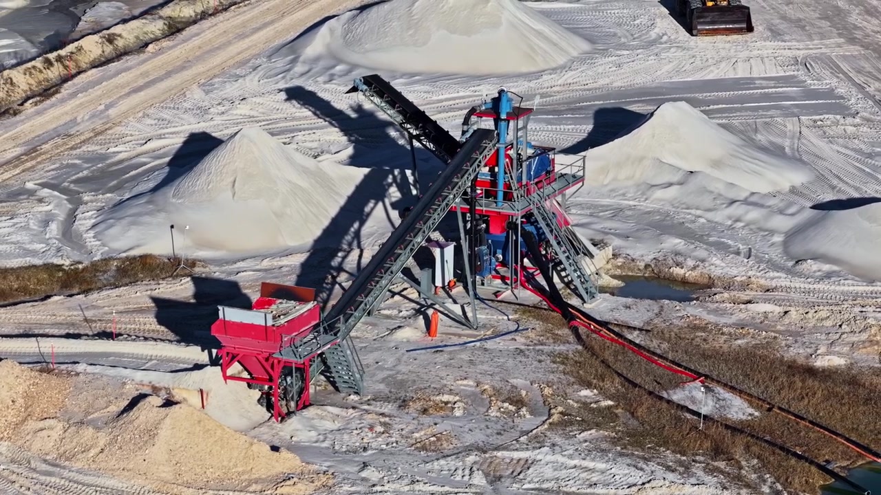Sand quarry with conveyor belts sorting and moving materials for processing