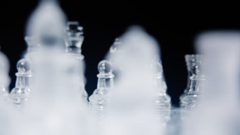 a gorgeous chessboard, with two different full sets of glass pieces, slowly rotating