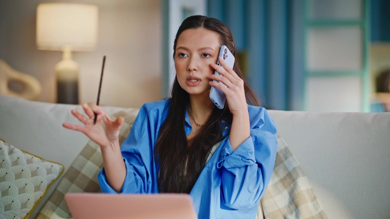 Frustrated woman phone call working laptop sofa. Closeup stressed freelancer.