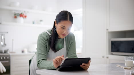 Kitchen,-network-and-Asian-woman-with-tablet