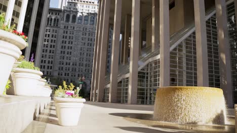 Buildings-and-a-water-fountain-in-downtown,-120fps