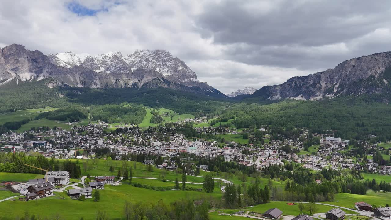 Drone view of Cortina d'Ampezzo city and surrounding alpine landscape