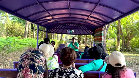 tourists enjoy scenic tram ride in thailand