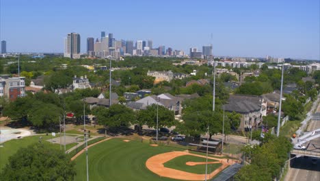 drone view of homes in affluent upper middle class neighborhood in houston, texas