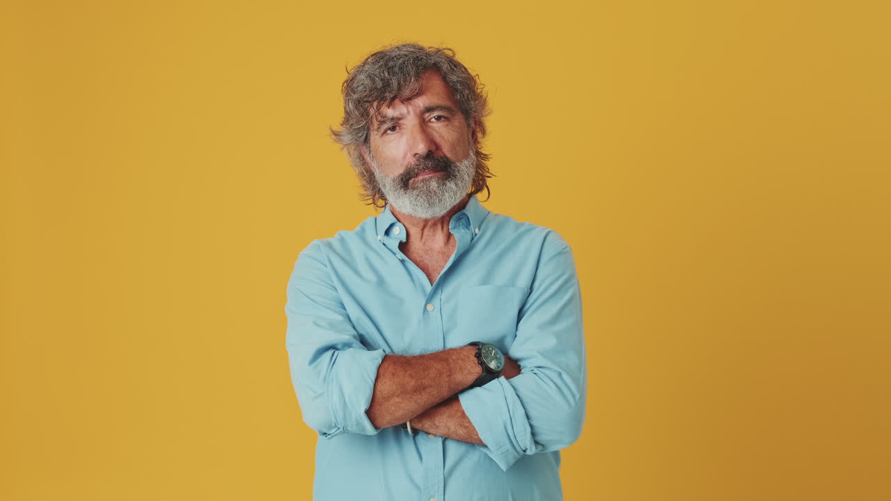 Mature Bearded Man Posing with Arms Crossed