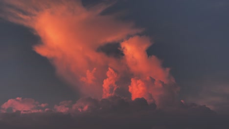 timelapse of evening sky with fast moving orange fluffy cloud, clouds at evening