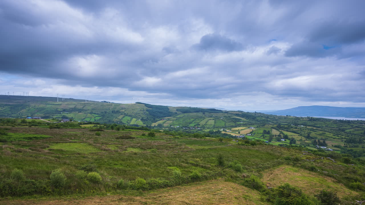 Time lapse of rural landscape with hills and lake in the distance on a sunny cloudy day in Arigna mountains in county Leitrim in Ireland