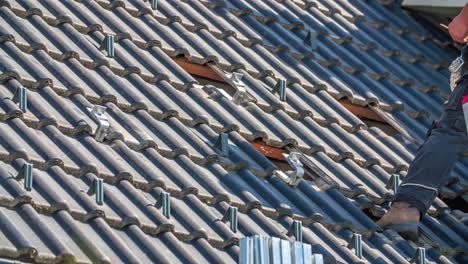 slide shot of roof with missing roof tiles, preparing for solar panel construction