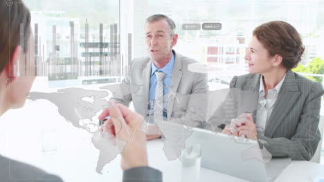 we see a group of businesspeople discussing data and charts together in a meeting