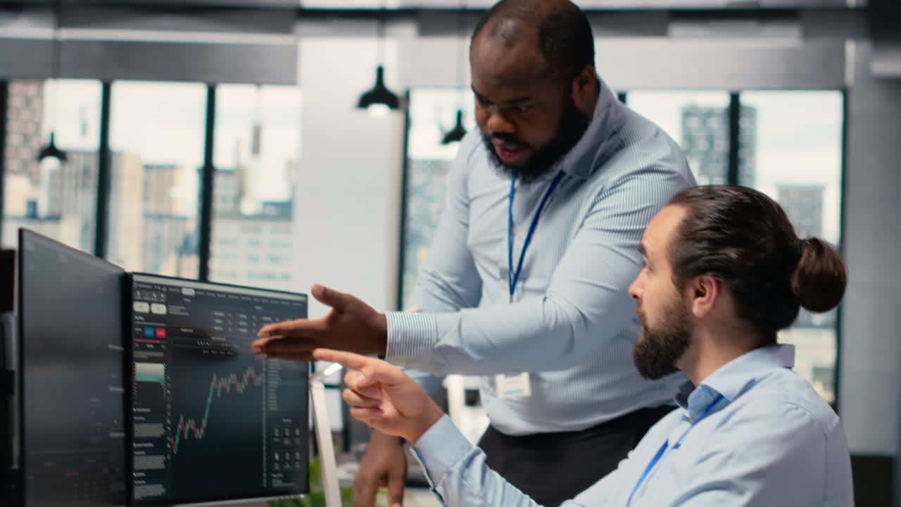 Prop firm staff members communicate to ensure smooth trading operations