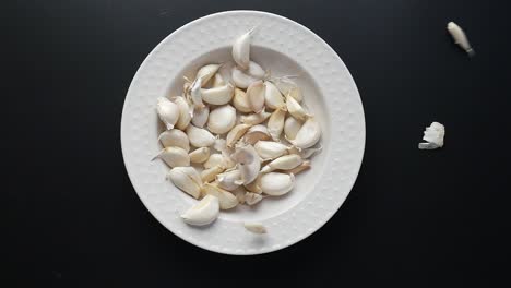 garlic cloves on a plate
