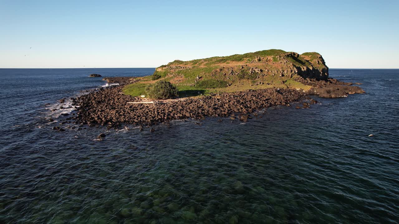 Rocky Shore Of Cook Island In NSW, Australia - Drone Shot