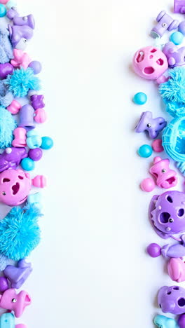 colorful assortment of baby toys and objects forming a border