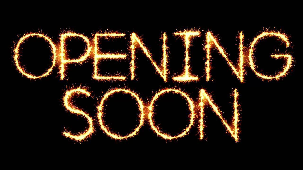 Opening soon text sparkler writing with glitter sparks particles firework on black 4k loop