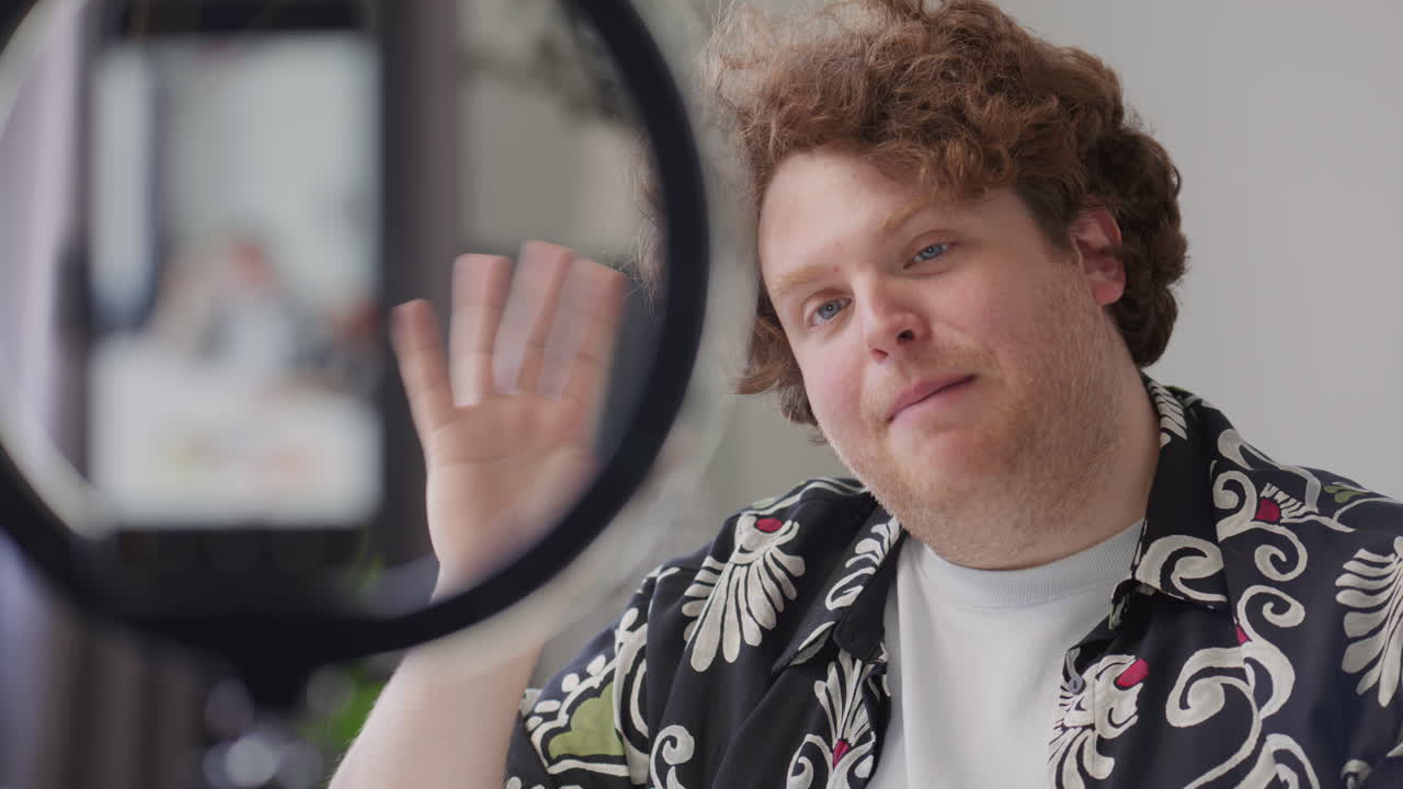 Man Recording Vlog for Social Media Platform with Phone and Ring Light