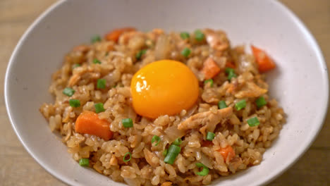 salmon fried rice with pickled egg on top - asian food style