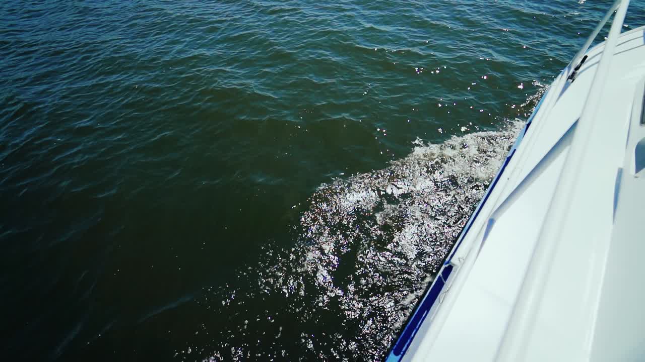 Beautiful woman riding on gondola. Girl is swimming in a boat