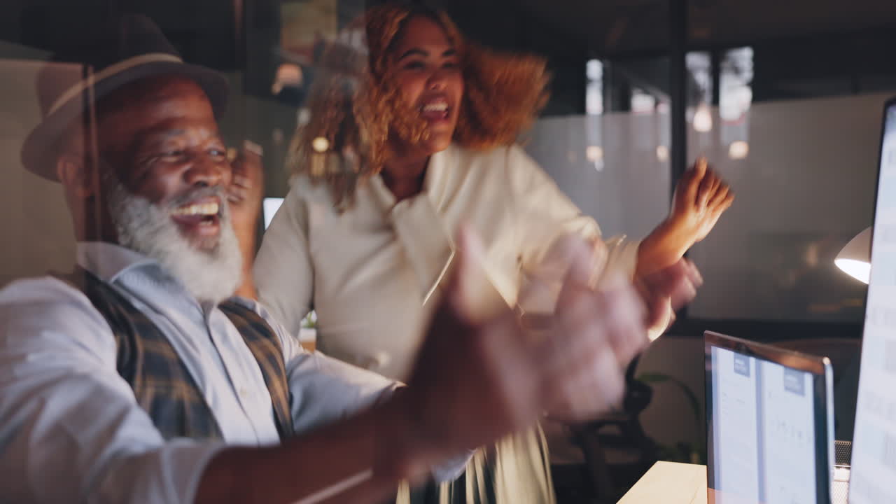Business people celebrate, dance for success