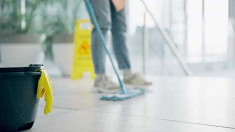 cleaning, person and mop on floor of office