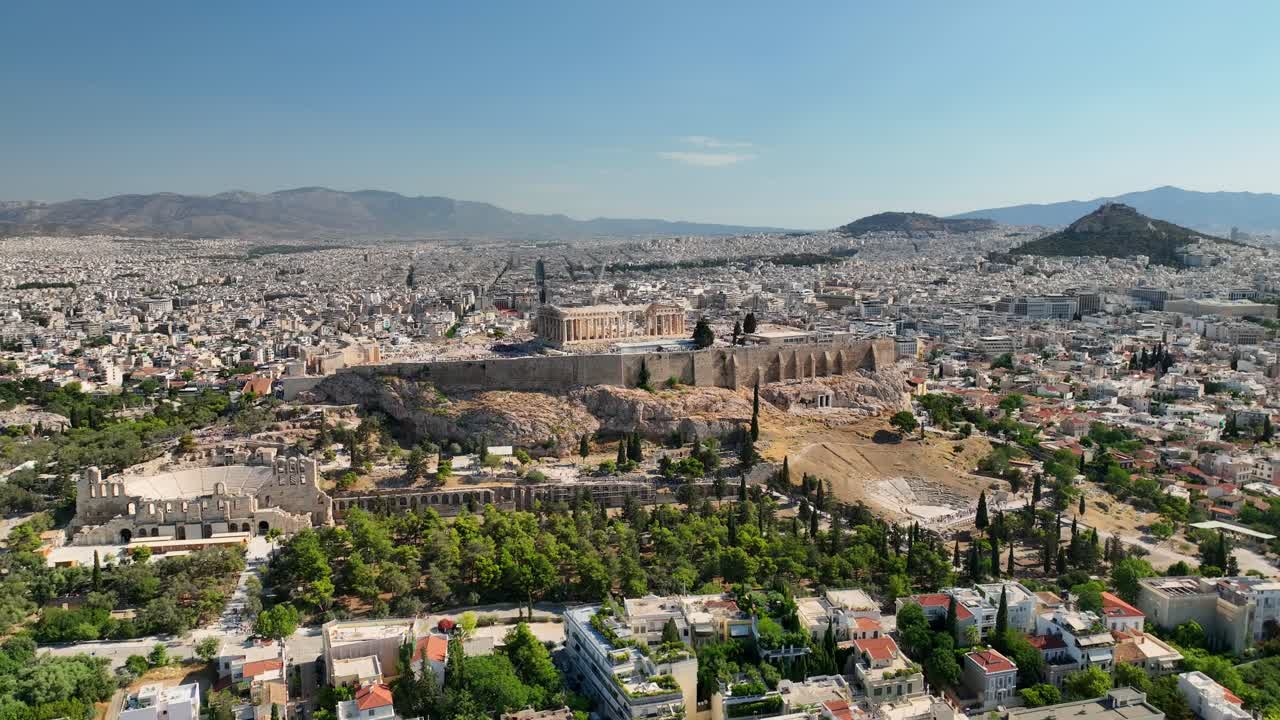 Acropolis Athens Greece aerial UHD footage of ancient ruins, Parthenon, and cityscape in bright summer daylight, showcasing cultural and historic significance.