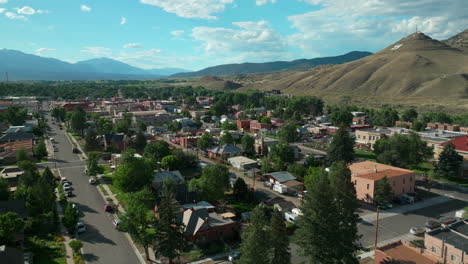 aerial cinematic drone mid summer downtown salida s lime mill colorado near buena vista on arkansas river riverside park scout surfing wave biking hiking rafting rocky mountain up high circling left