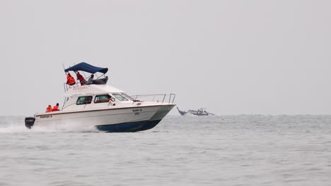 a speedboat travels swiftly near krabi islands