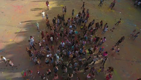 people celebrating festival of colors. vinnitsa, ukraine - july 2017: young people at holi party covered with color powder