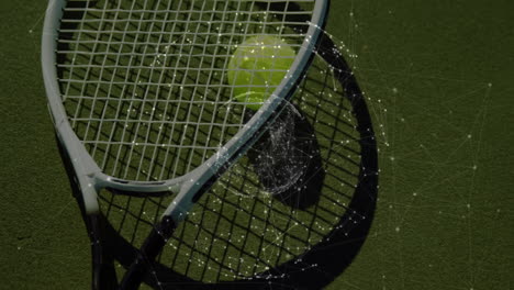 Tennis racket head holding tennis ball and projecting digital network lines across green court