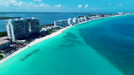 drone aerial landscape of hotel resorts along cancun sandy beach bay coastline with lagoon lake caribbean sea mexico quintana roo travel tourism holidays
