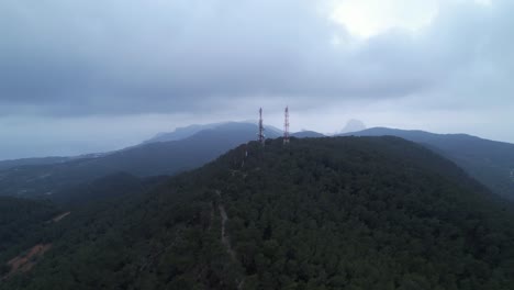 Cellular-tower-infrastructure-at-distant-Antenes-de-sa-Talaia-Spain