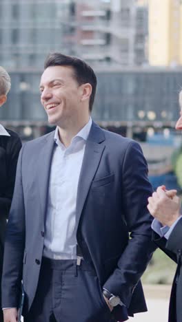 happy business professionals collaborating outdoors