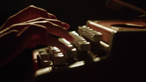 person typing on a vintage typewriter