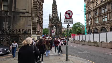 pedestrians walking near scott monument, edinburgh