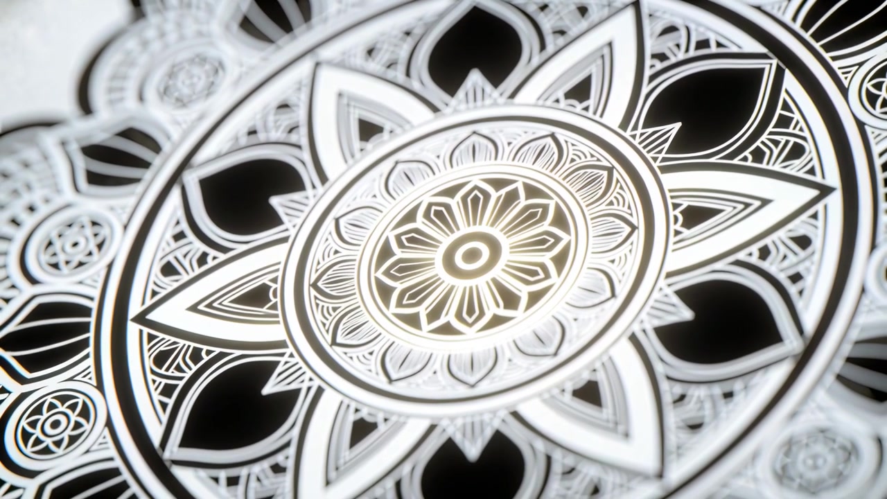 Panning camera after focus pull, pushing in and panning right at studio table, revealing mandala